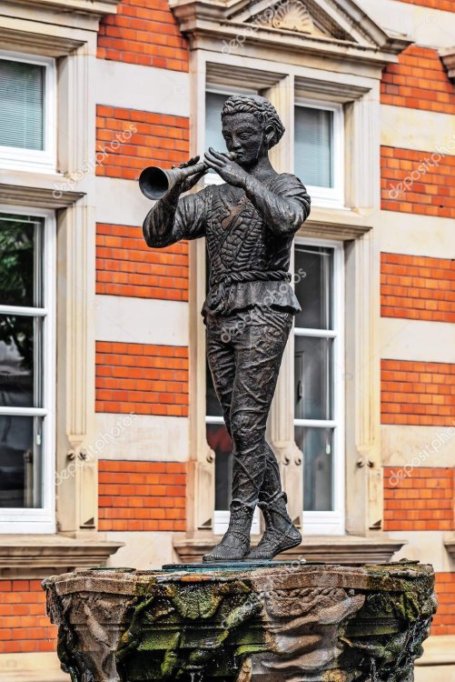 depositphotos_247998294-stock-photo-statue-of-pied-piper-of~2.jpg